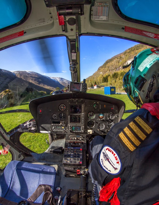 Doing paperwork while the rotor is slowing down. Loadmaster outside to make sure no one approaches the helicopter while the rotor is turning.